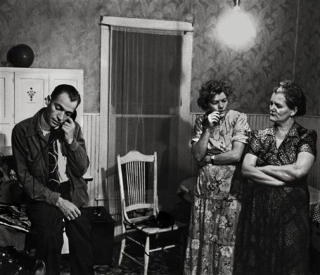 Knowing the man who suffered the heart attack at the boarding house will not make it through the night, Dr. Ceriani calls for a priest from the kitchen.